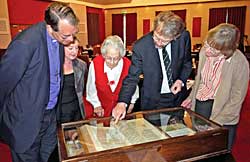 Inspecting the Beeston Bible at the Luncheon with verse 36 being pointed out by Professor John Becket. L to R: Bishop Paul Butler, Barbara Cast, Rosalys Coope, John Beckett and Dorothy Johnston (Photo: Howard Fisher).